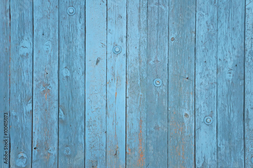 Wall from boards with old blue paint.