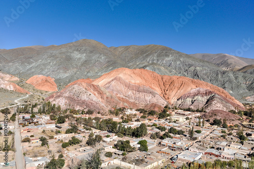 Distant view of Cerro de los Siete Colores, Purnamarca, Argentin photo