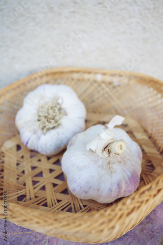 Raw garlic in basket