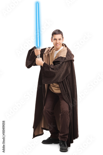 Man in warrior costume holding laser sword