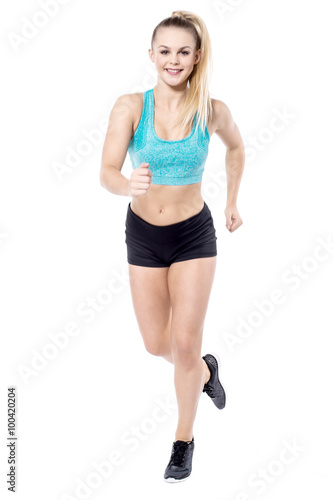 Young lady running in sportswear