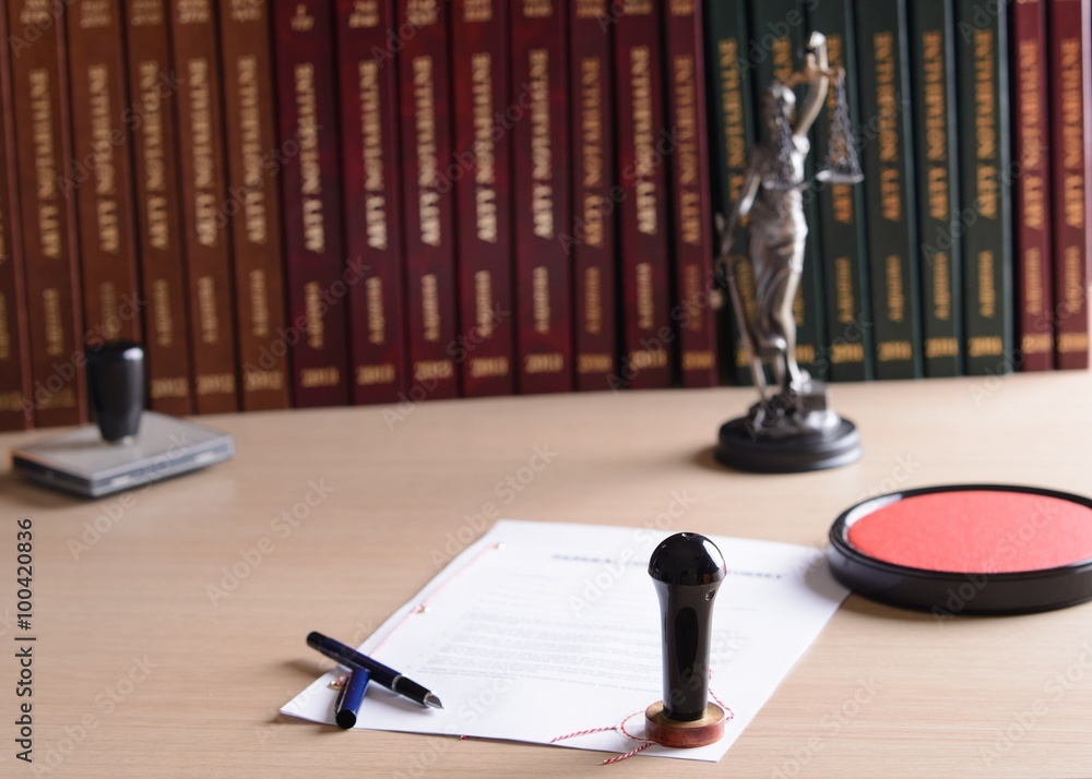 Signed by a notary public document with his stamp and pen.