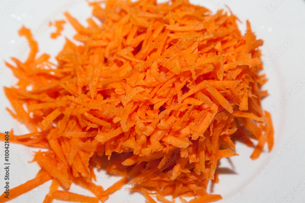 Closeup of grated carrot with selective focus Closeup of grated carrot with selective focus