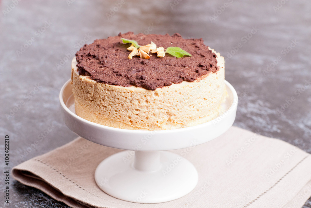 Cake of a souffle with glaze on a white plate. Cake of a souffle with glaze on a white plate.