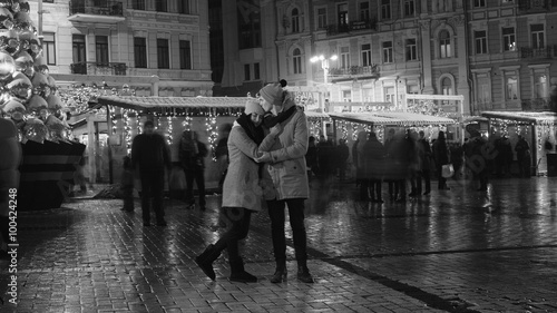 Young couple have date in city square