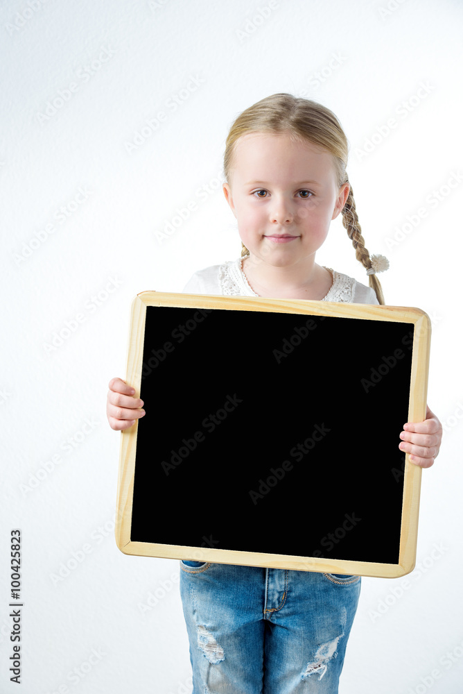 Little smiling girl withe copy space board Little smiling girl withe copy space board