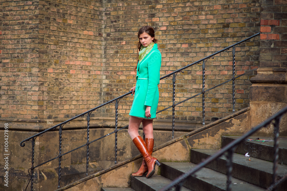 woman in green coat