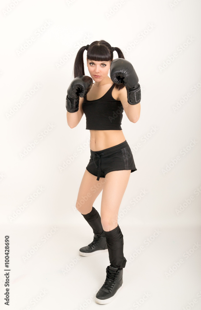 female boxer, fitness woman boxing wearing boxing black gloves