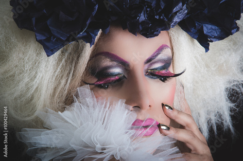 Quadro su tela Drag queen with spectacular makeup, glamorous trashy look, posing happily and ch