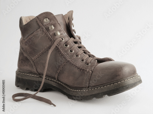 Old leather boot on a white background