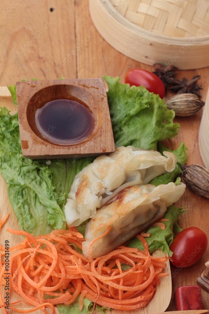 Fried gyoza and sauces - traditional Japanese food. Fried gyoza and sauces - traditional Japanese food.