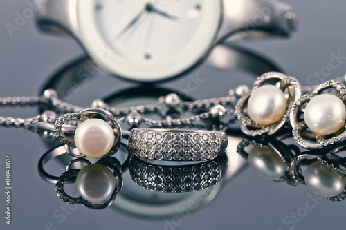 silver jewelry with pearls and elegant women's watches