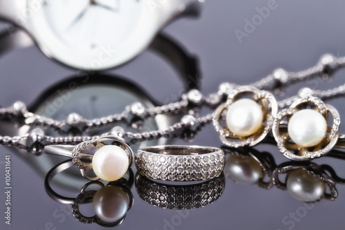 silver jewelry with pearls and elegant women's watches