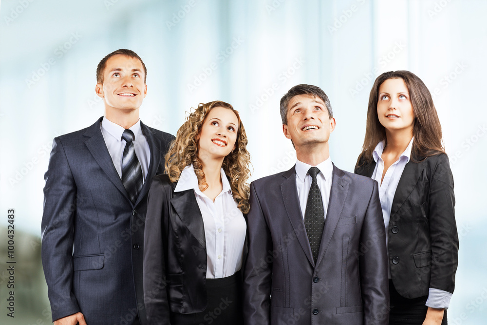 A group of attractive and successful business, ready for serious A group of attractive and successful business, ready for serious