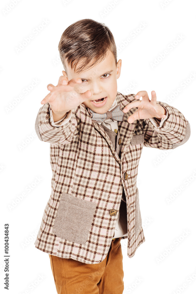 Portrait adorable young happy boy looking at camera isolated on
