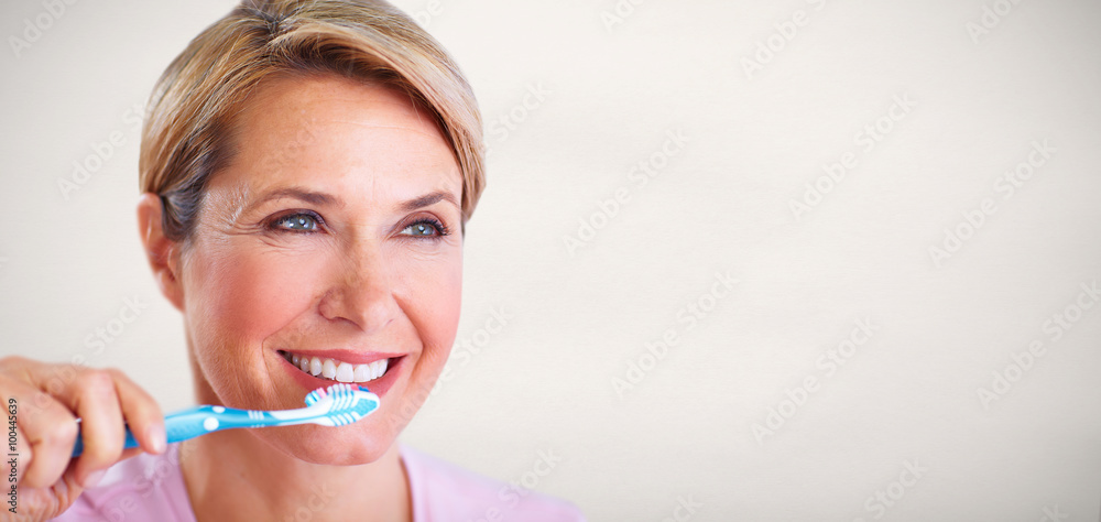 Beautiful senior woman with a toothbrush. Beautiful senior woman with a toothbrush.