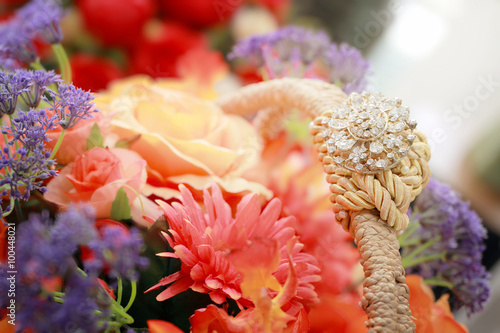 Beautiful bouquet of bright flowers in basket, shallow depth of field composition. © chokchaipoo