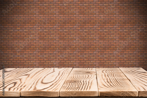 Empty table and brick wall in background. Great for product disp photo