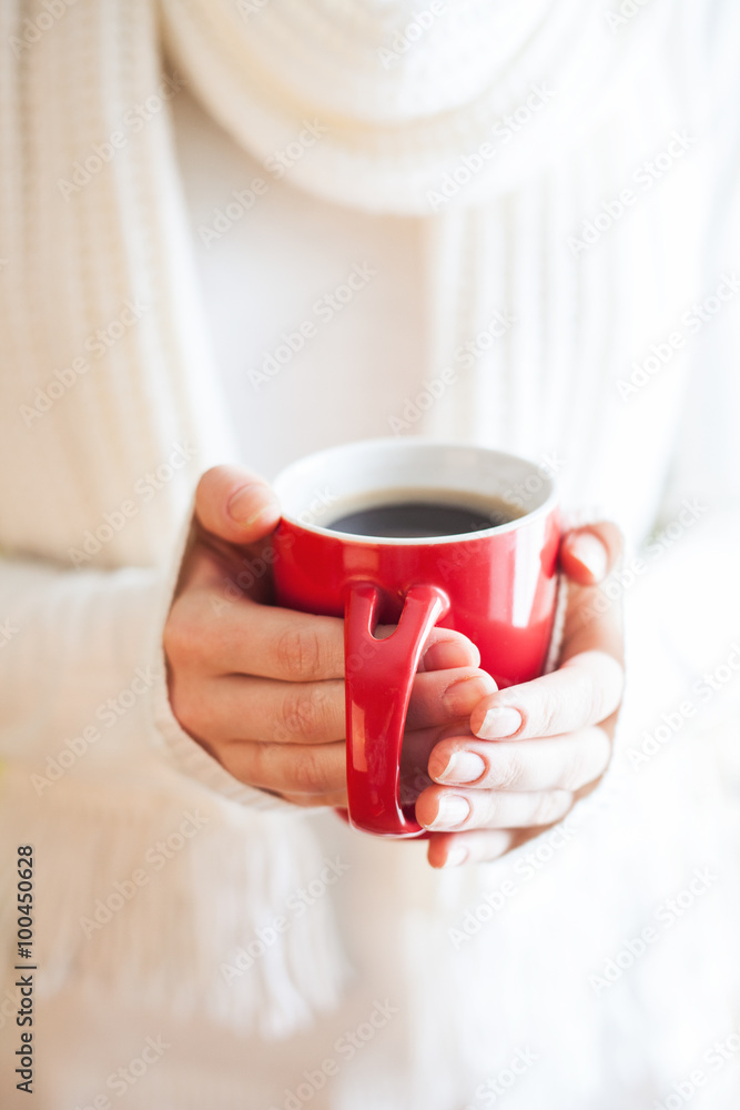 Woman holds a winter cup close up. Woman hands  holding a cozy k