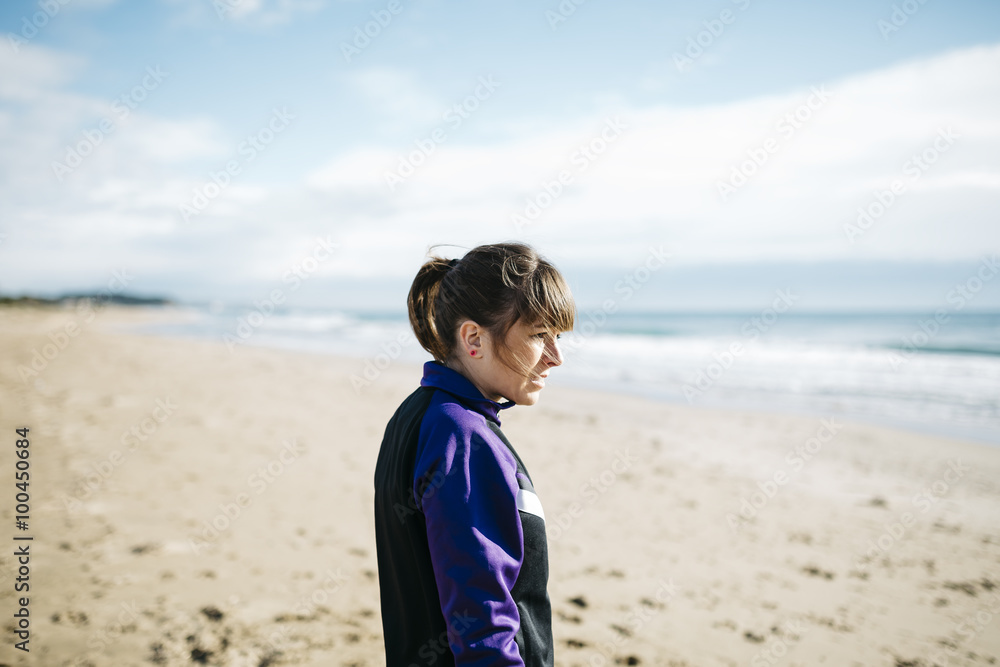 Beautiful young woman exercising on the beach. Fitness caucasian Beautiful young woman exercising on the beach. Fitness caucasian