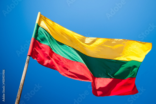 Flag of Lithuania over blue sky background