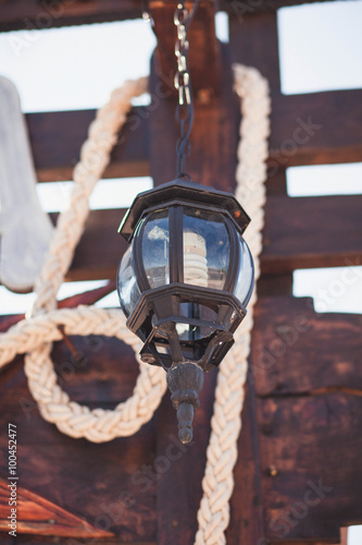 old lamp with a rope on the ship