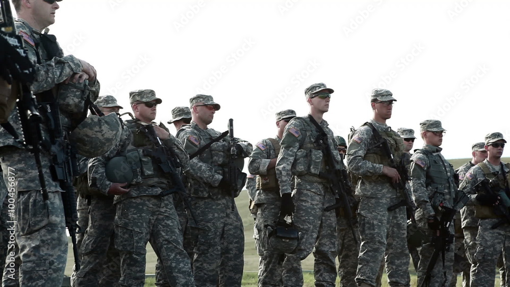 Backlit soldiers in full gear at training. Backlit soldiers in full gear at training.