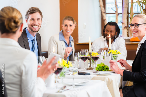 Team at business lunch in restaurant