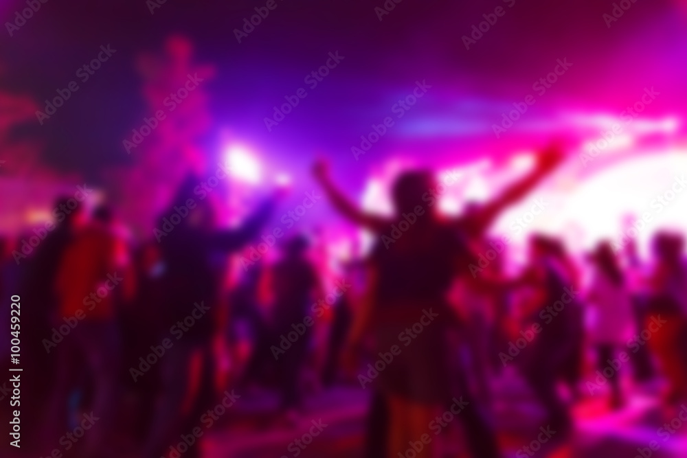 silhouette crowd in front of concert stage