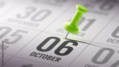 Photos October 06 written on a calendar to remind you an important appo