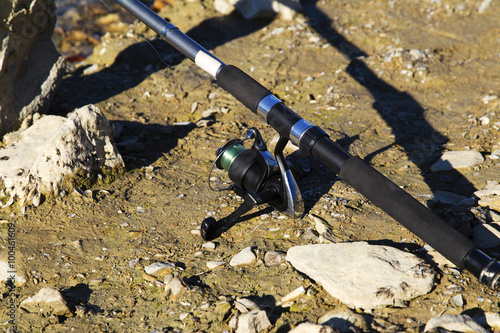 Fishing rod on the ground closeup