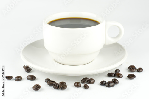 white cup with coffee beans, isolated on white background