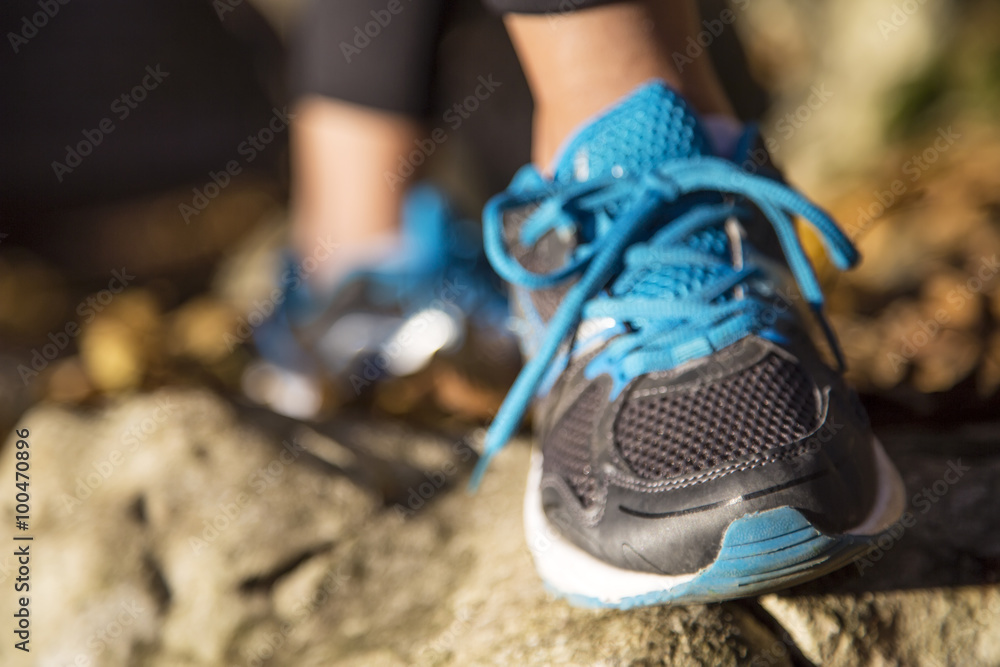 Running feet of young woman closeup on shoe Running feet of young woman closeup on shoe