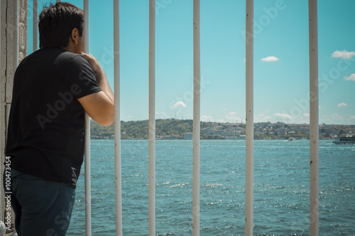 Tourist looking through the bars in Istanbul © bilalizaddin