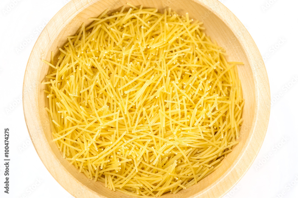 Raw uncooked pasta in bowl 