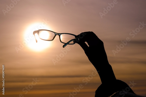Ocean sunset through the sunglasses