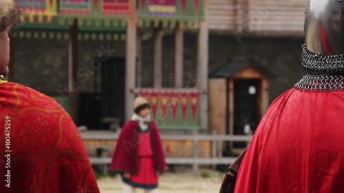Medieval feudal lord watching military parade, royal army knights riding horses