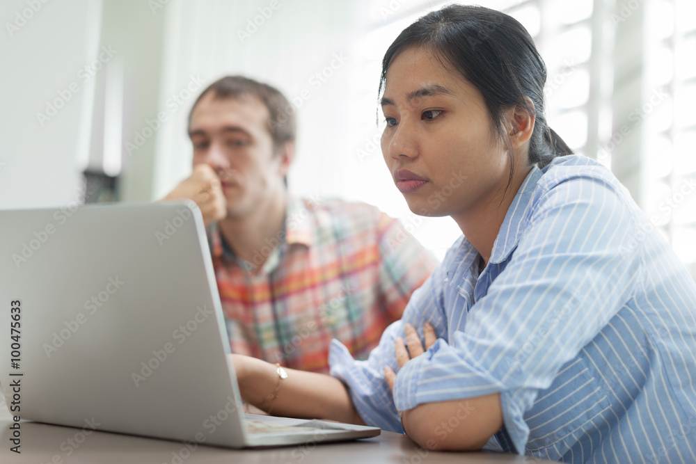 Business woman using laptop sitting office desk