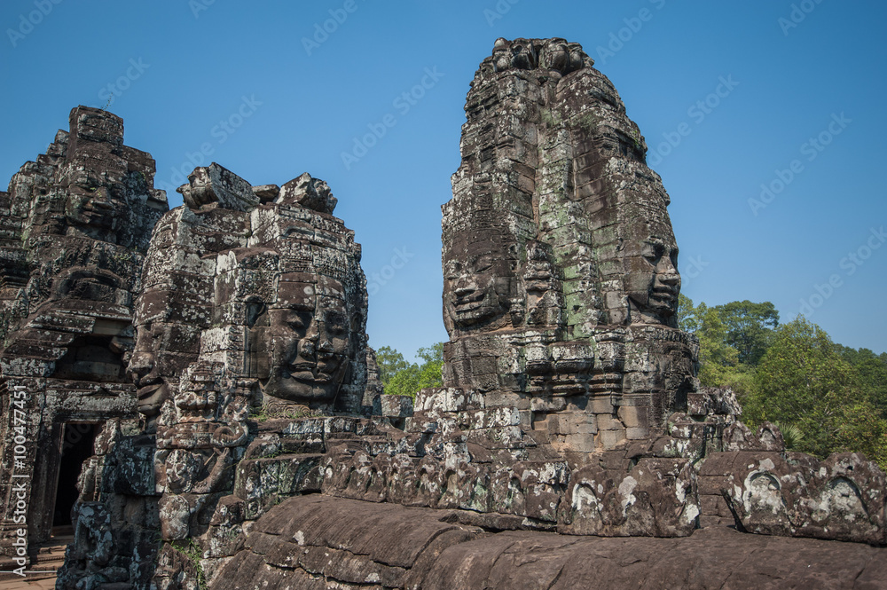 Carved stone heads of Bayon temple, Angkor Wat, Cambodia Carved stone heads of Bayon temple, Angkor Wat, Cambodia