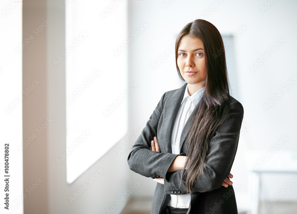 Portrait of young beautiful business woman in the office Portrait of young beautiful business woman in the office
