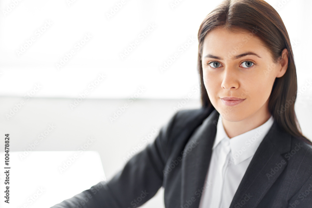 Portrait of young beautiful business woman in the office Portrait of young beautiful business woman in the office
