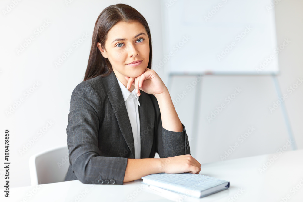 Portrait of young beautiful business woman in the office Portrait of young beautiful business woman in the office