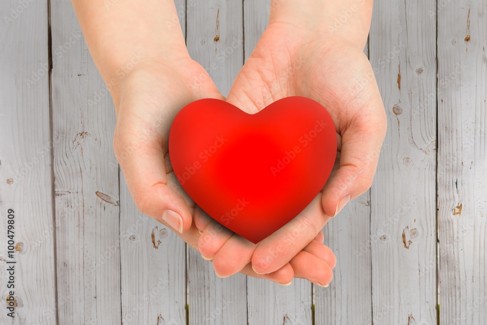 Composite image of hand showing heart Composite image of hand showing heart