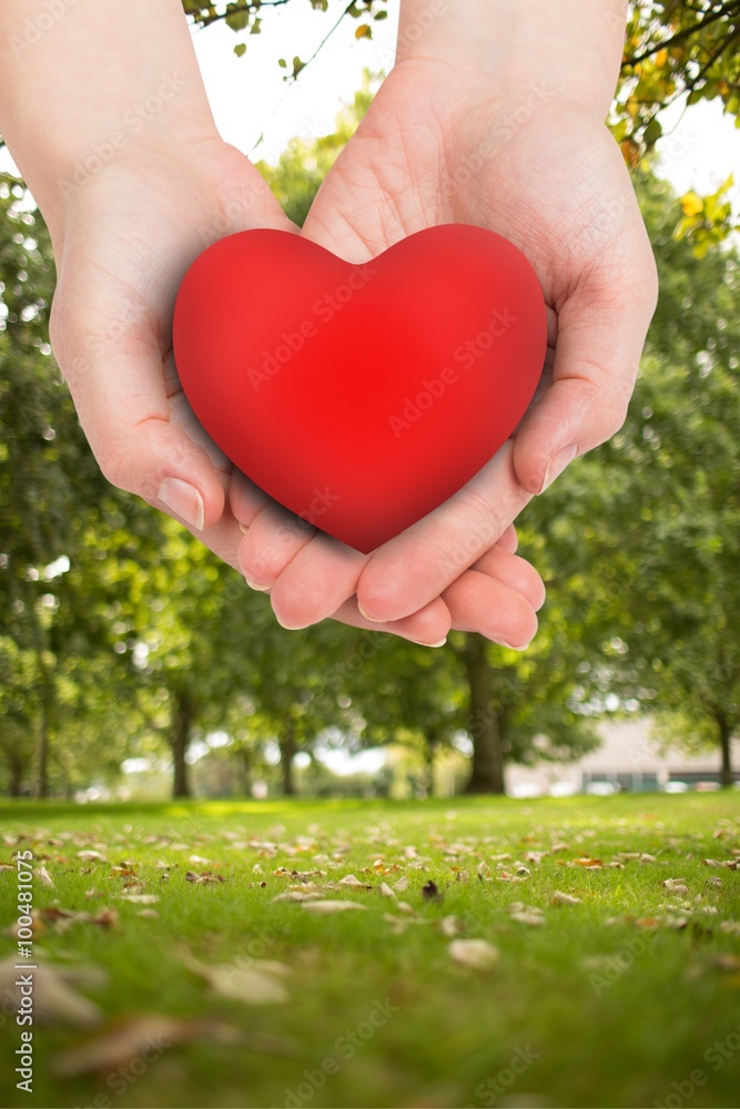 Composite image of hand showing heart Composite image of hand showing heart