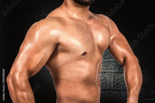 Composite image of muscular man flexing his biceps
