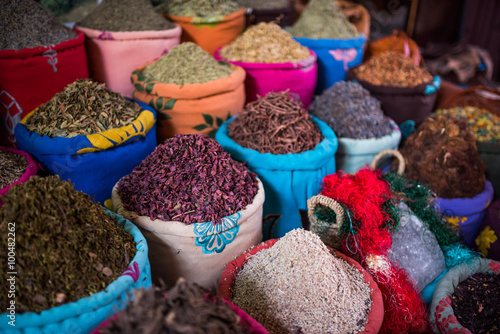 Containers of herbs for sale in the souks of Marrakesh
