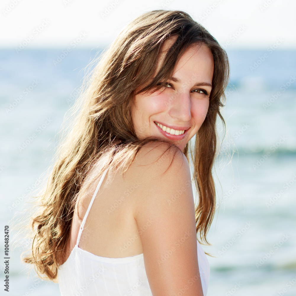 Young happy woman near the sea Young happy woman near the sea