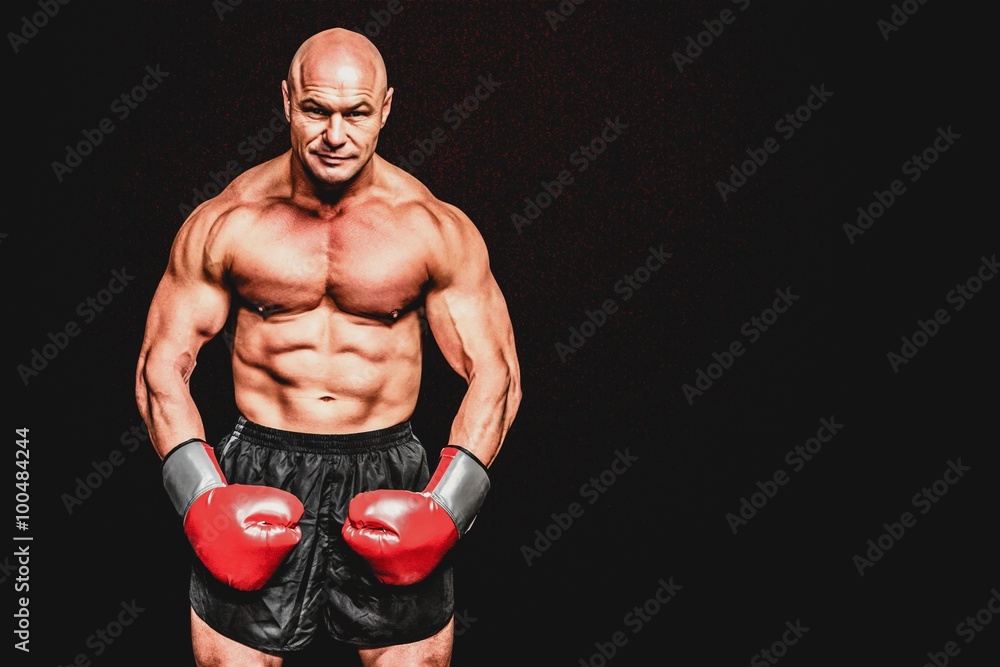 Bald boxer flexing muscles Bald boxer flexing muscles