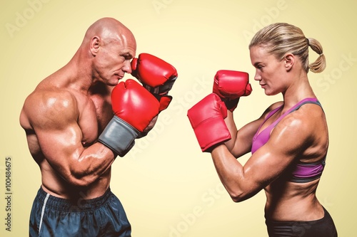 Composite image of side view of boxers with fighting stance © vectorfusionart