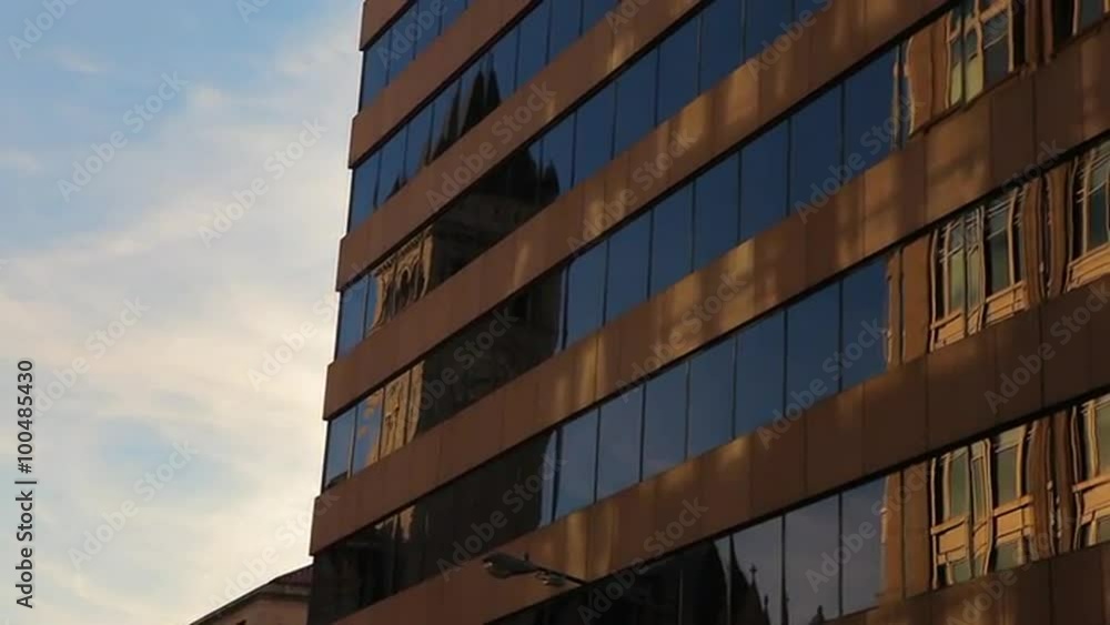 Static shot of a brown building with glass windows in Washington DC Static shot of a brown building with glass windows in Washington DC